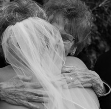 Bride and her mother hugging right after the ceremony. Carol Cizauskas and Gene Cizauskas. The Plumas House, Reno, Nevada. Saturday, 12 October 2013
